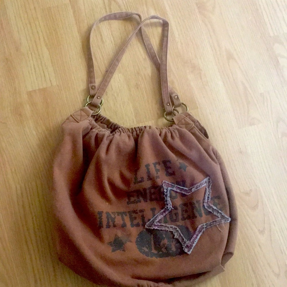 Brown L.e.i tote bag with zipper compartment inside.